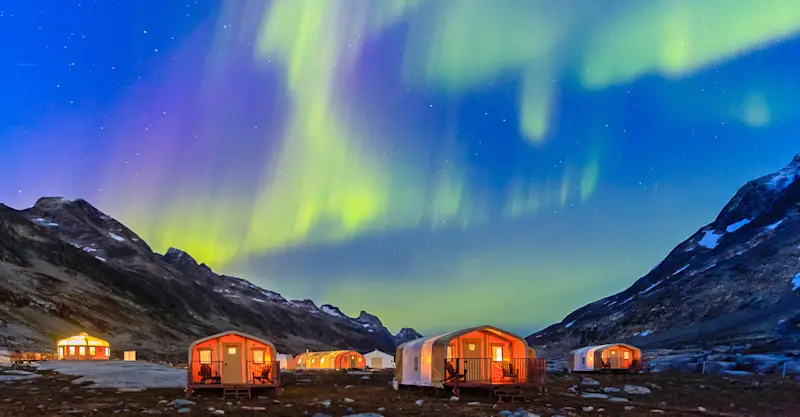 Northern lights above Nat Hab's private Base Camp Greenland, East Greenland.