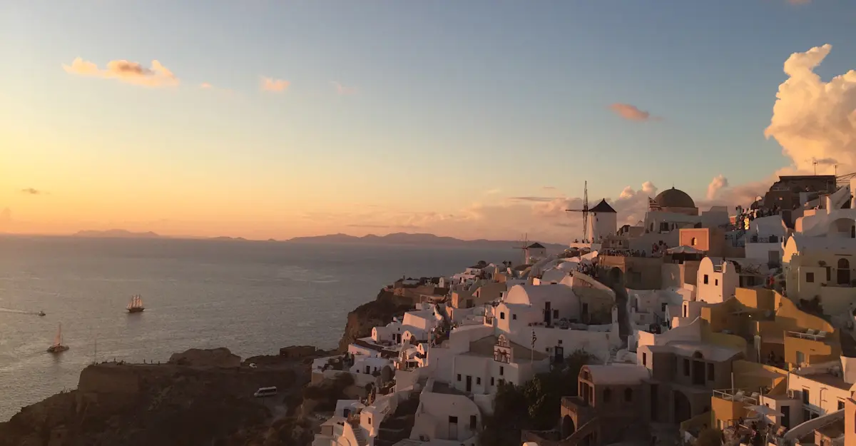 Domes, white walls, and endless sea, Santorini, Greece.