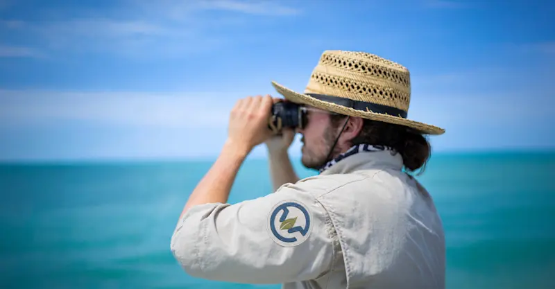 Earthwatch Expeditions Scientist searching for marine wildlife, Baja, Mexico.