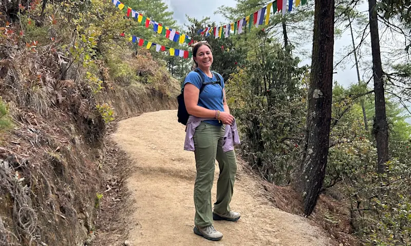 Big smile on the hike up to the famed Tiger's Nest (Paro Taktsang) Monastery in Bhutan.