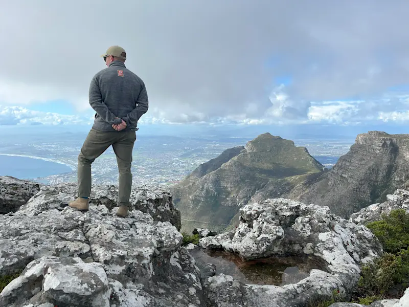 On Table Mountain, taking in Cape Town, South Africa.