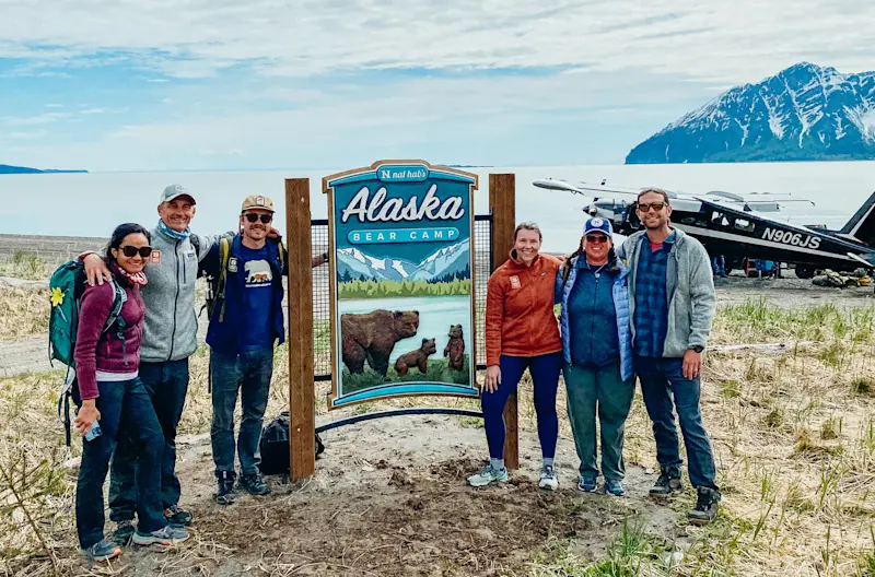 Installing the sign at Bear Camp, Alaska.