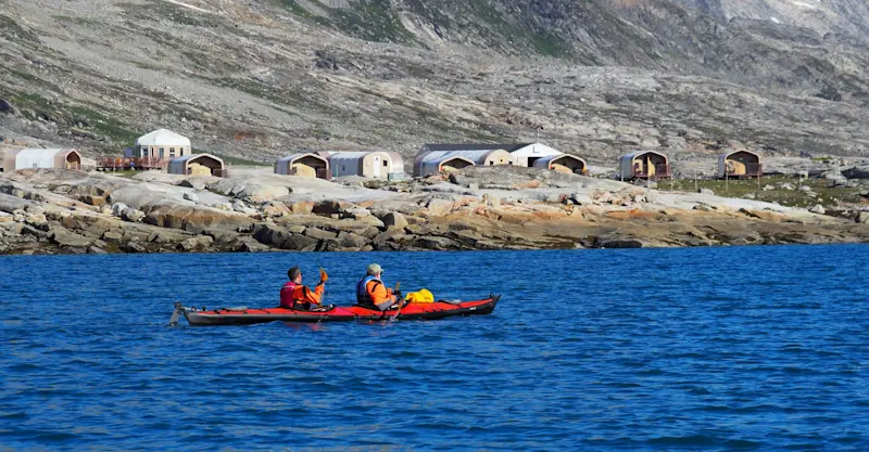 Guests kayaking at Nat Hab's Base Camp Greenland