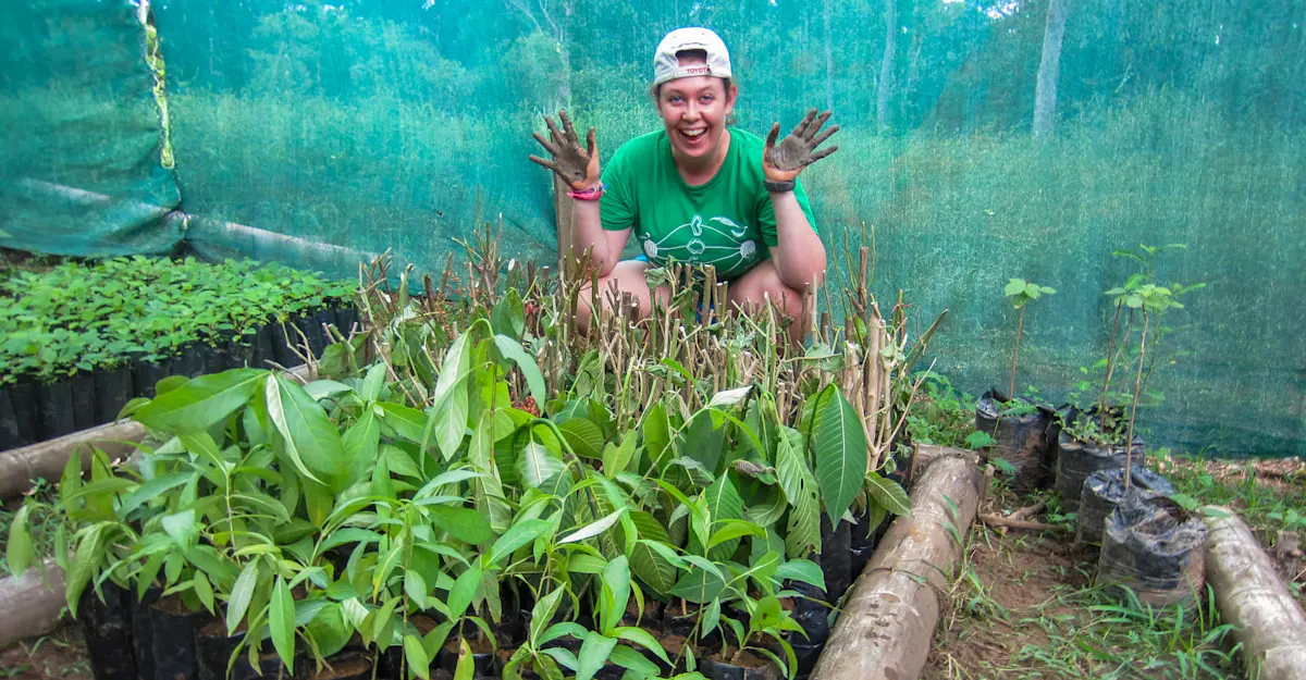 Earthwatch Expeditions guest planting in the greenhouse, Osa Peninsula, Costa Rica.