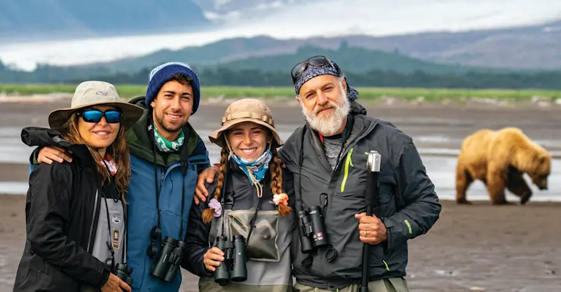 Nat Hab guests and brown bear, Katmai National Park & Preserve, Alaska.