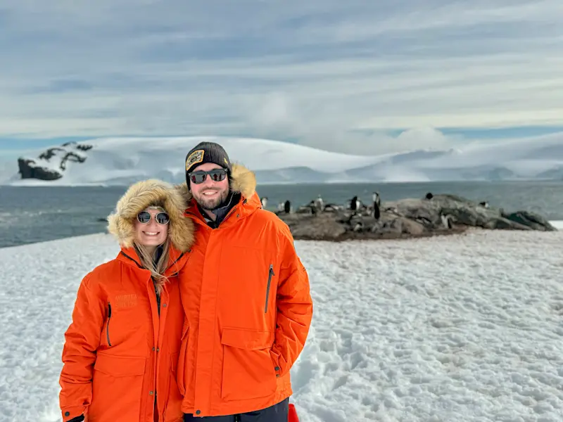 Posing with penguins at Mikkelsen Harbor, Antarctica.