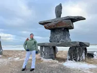 Visiting the Inukshuk, a man-made stone used by the Inuit, located in Churchill, Canada.