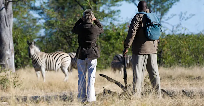Nat Hab guest and local guide, Linyanti Reserve, Botswana.