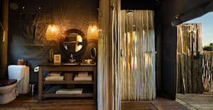 Guest tent bathroom with indoor and outdoor shower