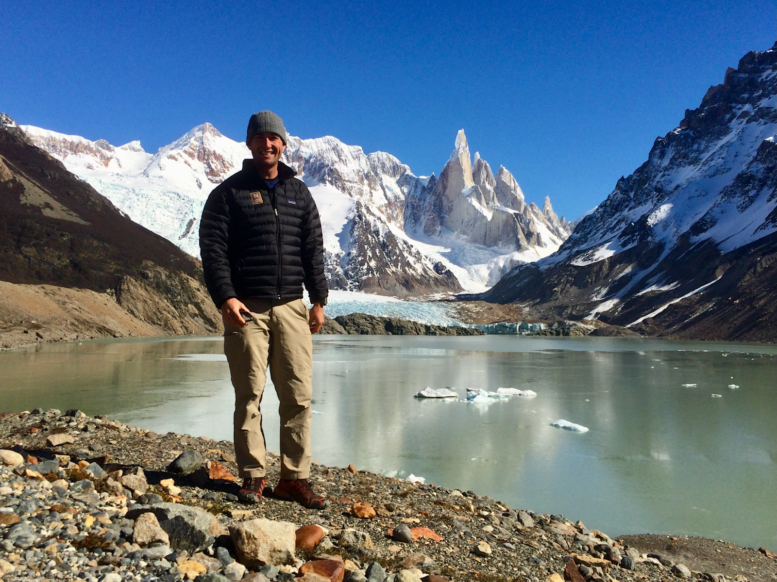 Grinning on a bluebird  (and windless!) day in front of Cerro Torre in El Chalten, Argentina.