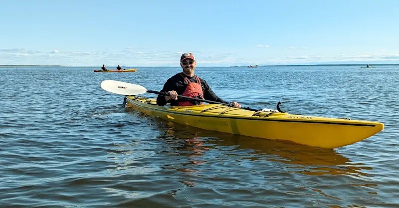 Kayaking at the mouth of the Churchill River on the Hudson Bay, Canada.