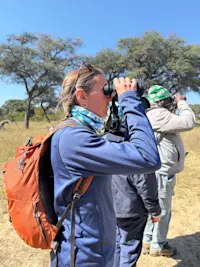 Viewing animals on a walking safari in Hwange National Park in Zimbabwe.