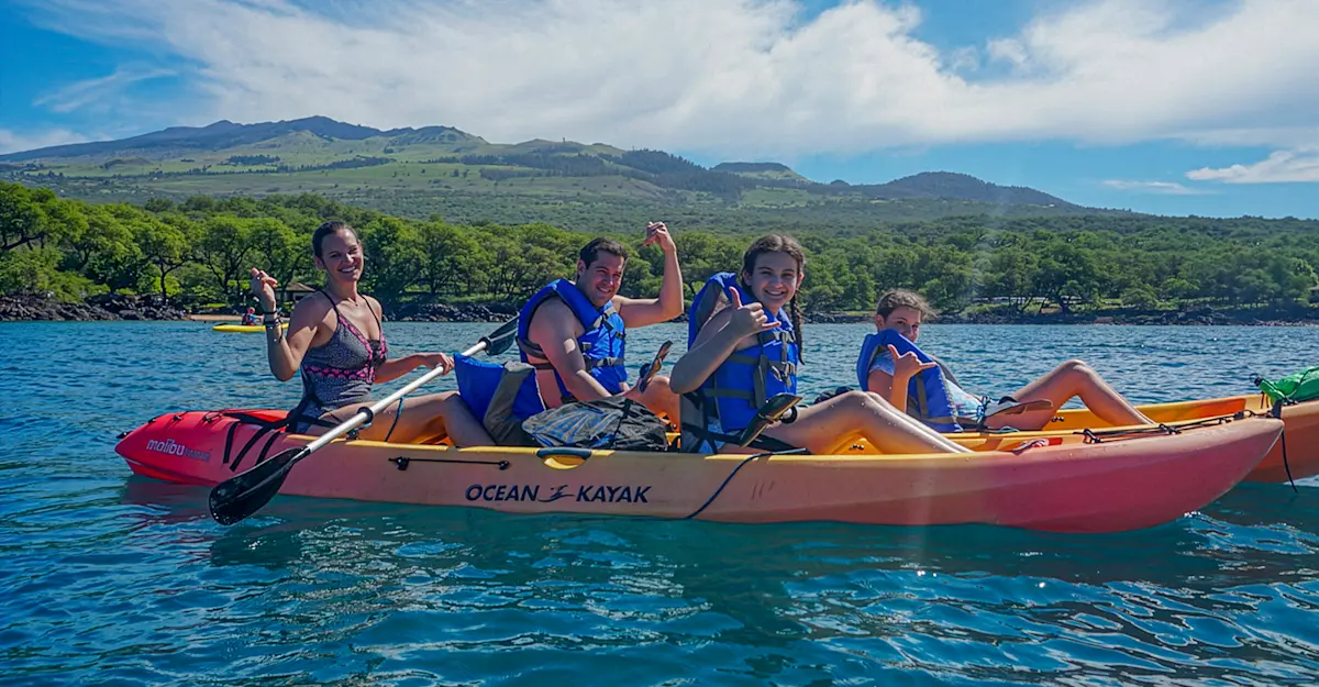 Kayaking into family adventure off the coast of Maui, Hawaii.