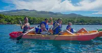 Kayaking into family adventure off the coast of Maui, Hawaii.