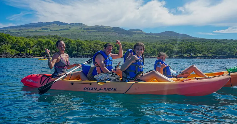 Kayaking into family adventure off the coast of Maui, Hawaii.