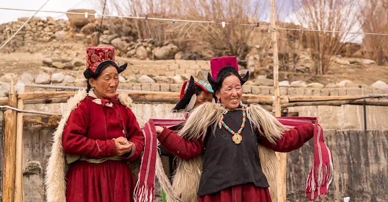 Women dressed in traditional Tibetan attire, Ladakh, India.
