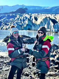 Clinking our champagne glasses at Fjallsárlón Glacier Lagoon in Iceland.
