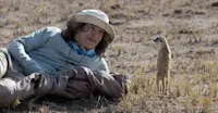 Nat Hab guest and meerkat, Makgadikgadi Pans, Kalahari Desert, Botswana.