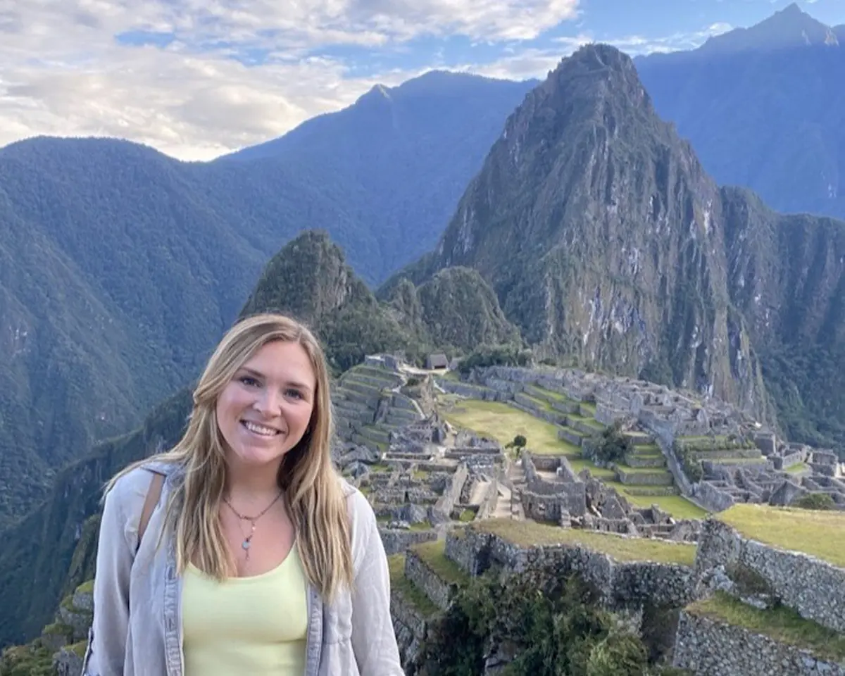 Hiking ancient stone paths through Machu Picchu in Cusco, Peru.