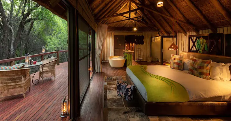 Guest room with bathtub and deck