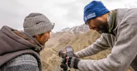 Nat Hab Expedition Leader and local spotter, Himalaya mountain range, India.