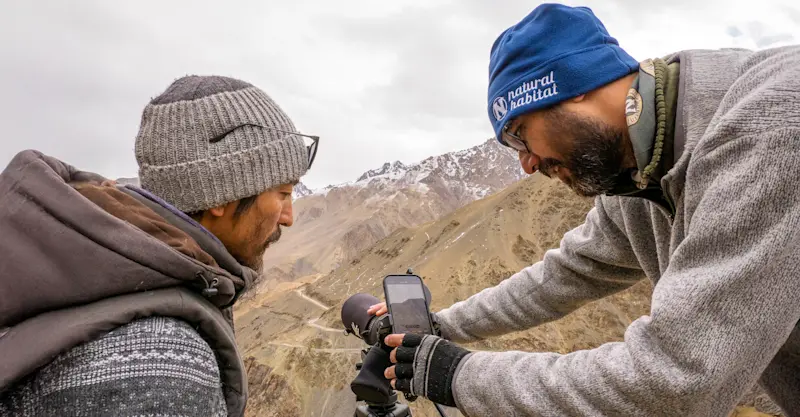 Nat Hab Expedition Leader and local spotter, Himalaya mountain range, India.