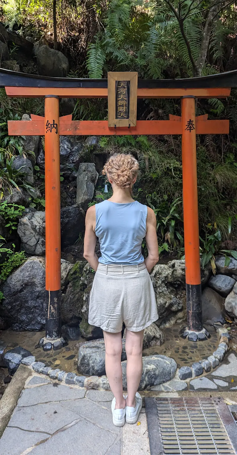 A moment of peace at Shinto shrine Torii gate in Japan.