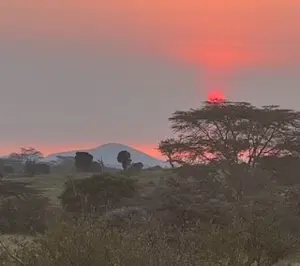 Beautiful sunset at Nat Hab's Mara East Camp in Kenya.