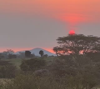 Beautiful sunset at Nat Hab's Mara East Camp in Kenya.