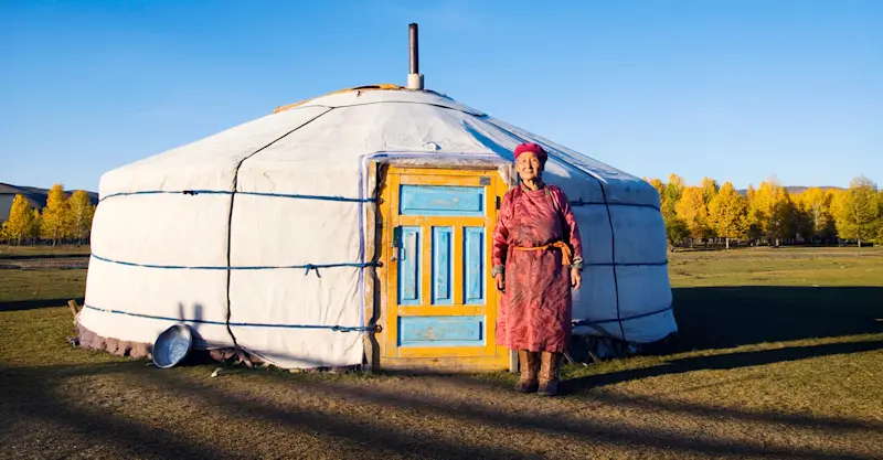 Mongolian woman in front of ger, Mongolia.