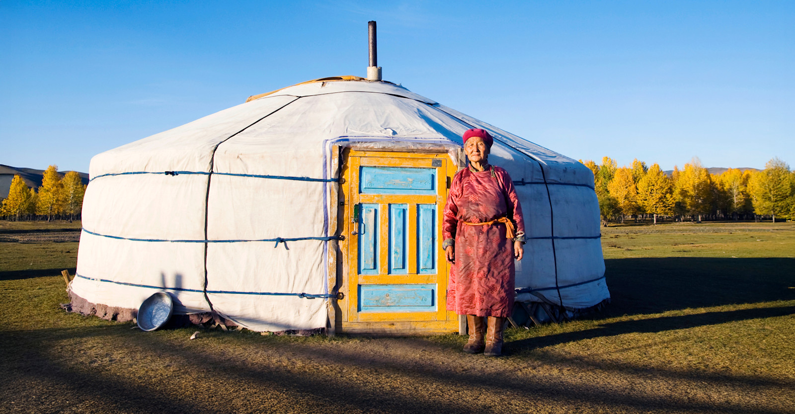 Mongolian woman in front of ger, Mongolia.
