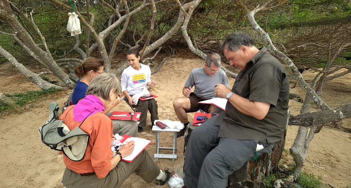 Bird banding Darwins Finches on the Galapagos with Earthwatch.