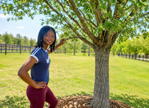 A sunny moment outdoors in Colorado, framed by the shade of a leafy tree.
