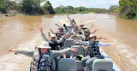 Nat Hab guests on private river cruise, Pantanal, Brazil.