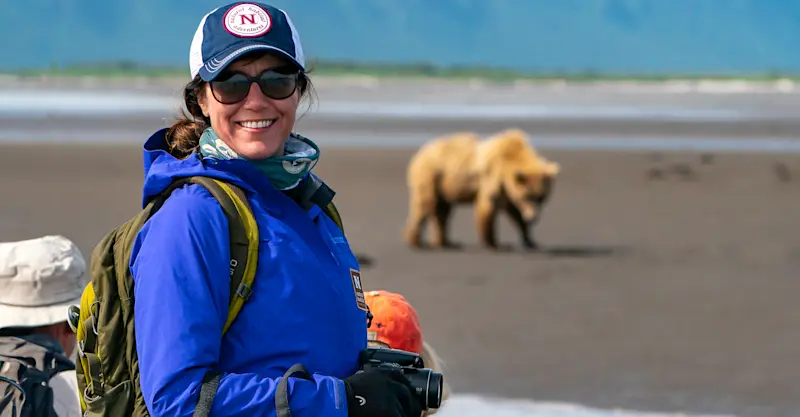 Nat Hab guests and brown bear, Katmai National Park & Preserve, Alaska.