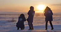 Nat Hab guests photographing tundra sunset, Churchill, Manitoba.