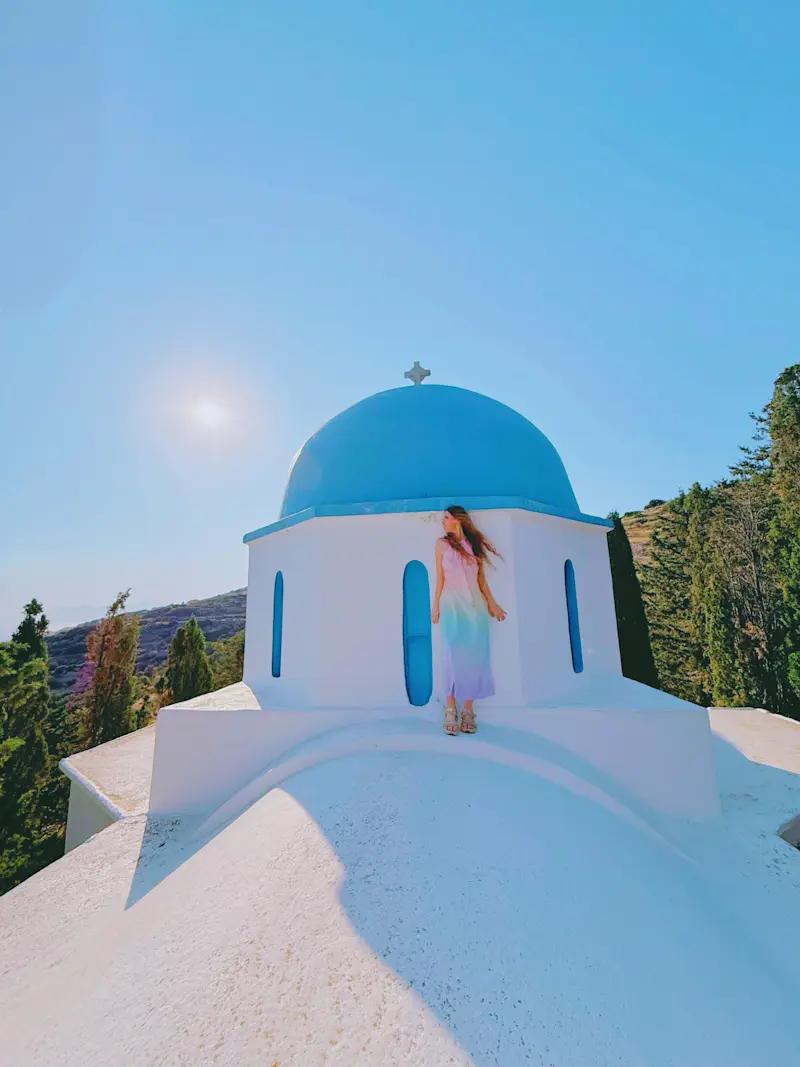 Greeting the sun in the traditional village of Lefkes on the island of Paros, Greece, before hiking the ancient Byzantine Path. 