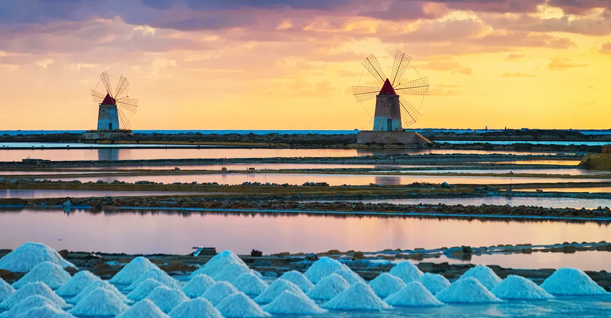 Traditional windmills at the Marsala Salt Pans, Sicily, Italy.