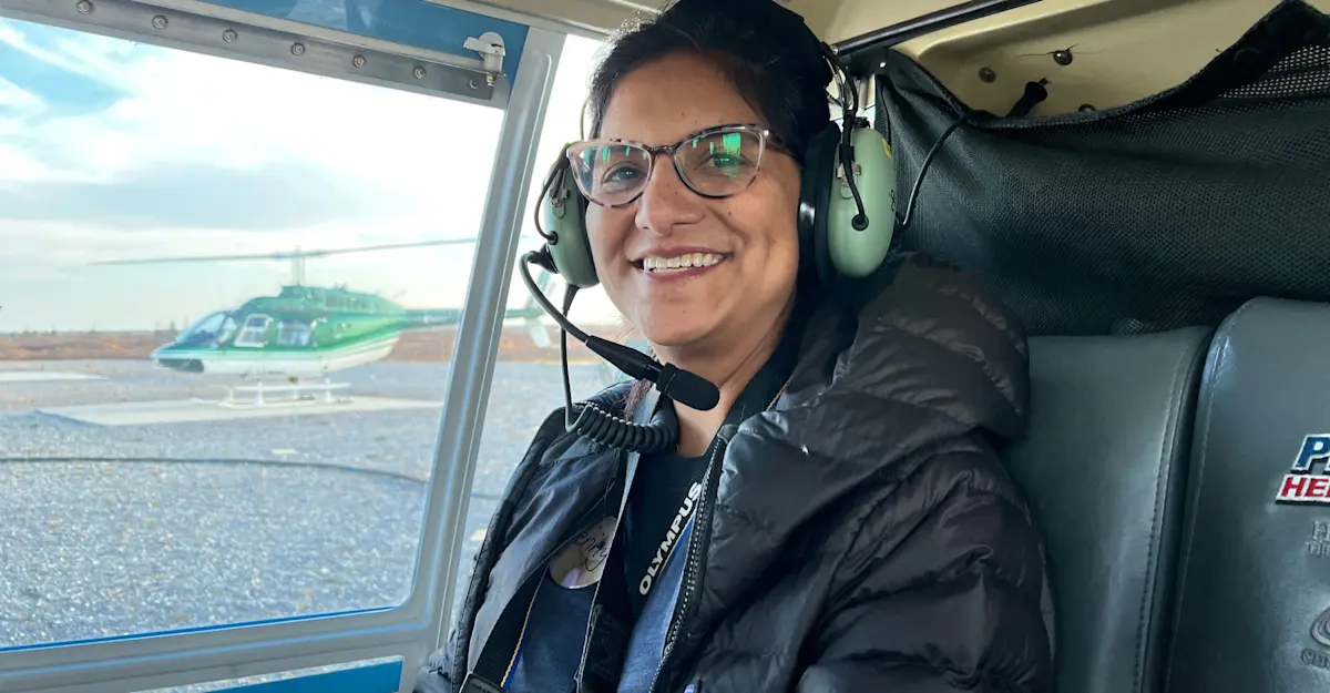 Earthwatch Expeditions guest on a helicopter tour of the tundra, Churchill, Manitoba, Canada.