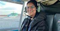 Earthwatch Expeditions guest on a helicopter tour of the tundra, Churchill, Manitoba, Canada.
