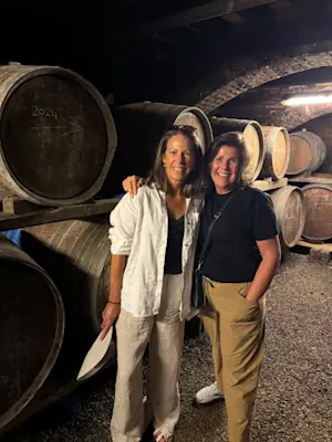 A friend and I touring the wine cellar at Pacina, an organic farm and vineyard in Tuscany, Italy