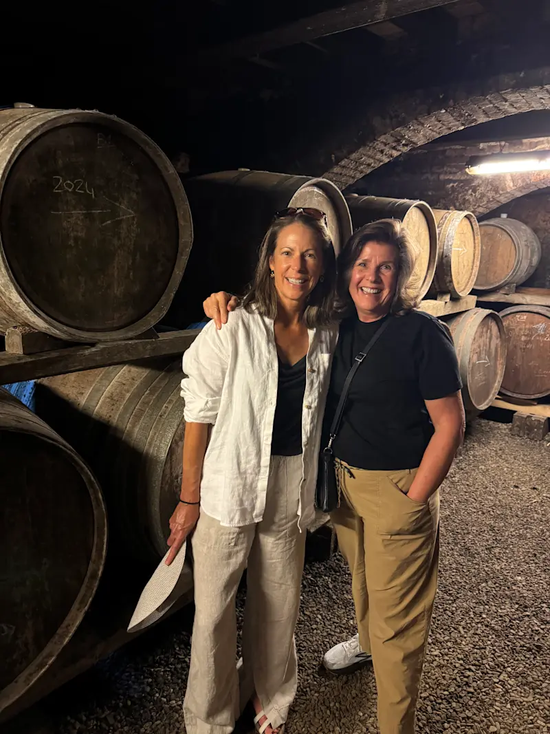 A friend and I touring the wine cellar at Pacina, an organic farm and vineyard in Tuscany, Italy