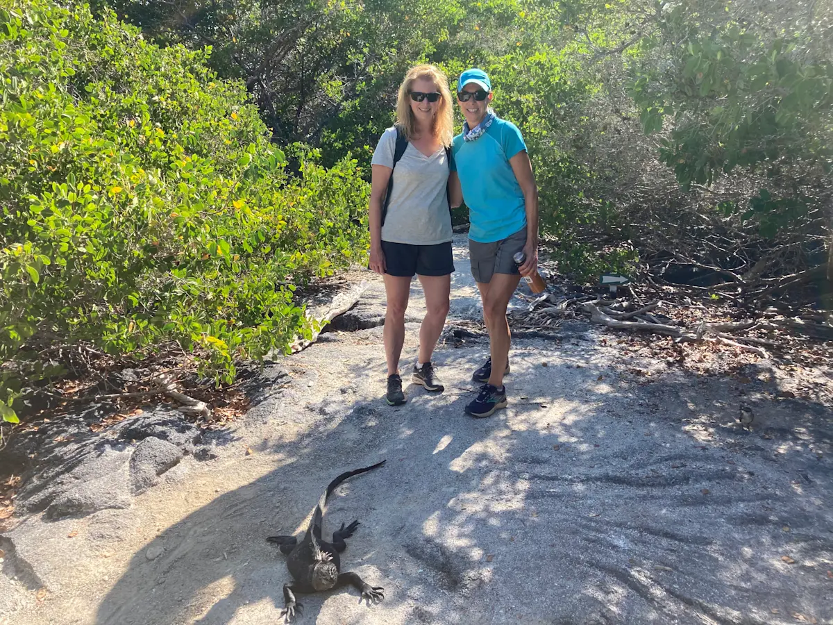 With a buddy and our first marine iguana in Galapagos.
