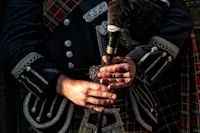 Bag piper, Scotland.