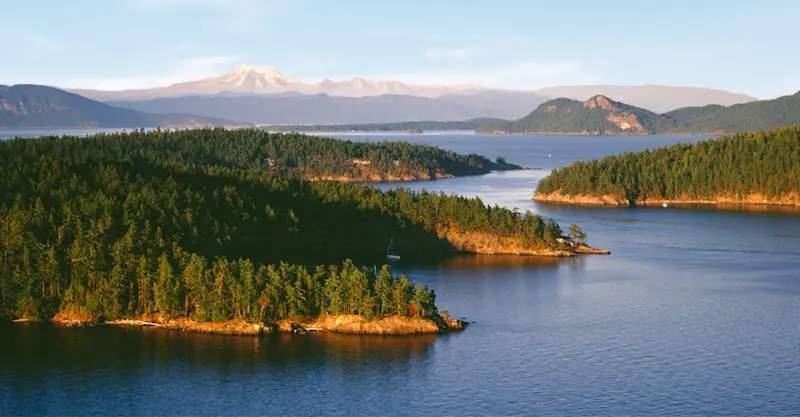 Orcas Island and Obstruction Pass with Mt. Baker in the distance, San Juan Islands, Washington.
