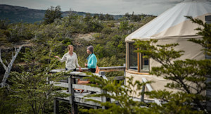 Guests on deck outside of a yurt