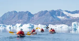 Nat Hab guests kayaking, Sermilik Fjord, Greenland.