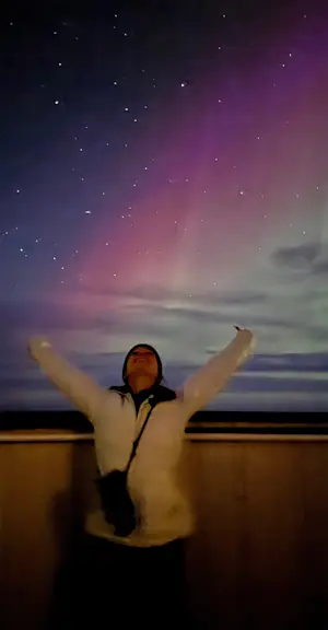 Enjoying the Northern Lights from the Tundra Lodge on Hudson Bay, Churchill, Canada.