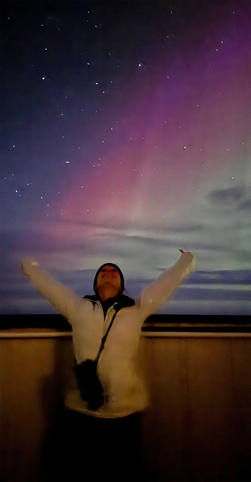 Enjoying the Northern Lights from the Tundra Lodge on Hudson Bay, Churchill, Canada.