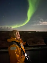 Nat Hab guest and northern lights, Churchill, Manitoba.